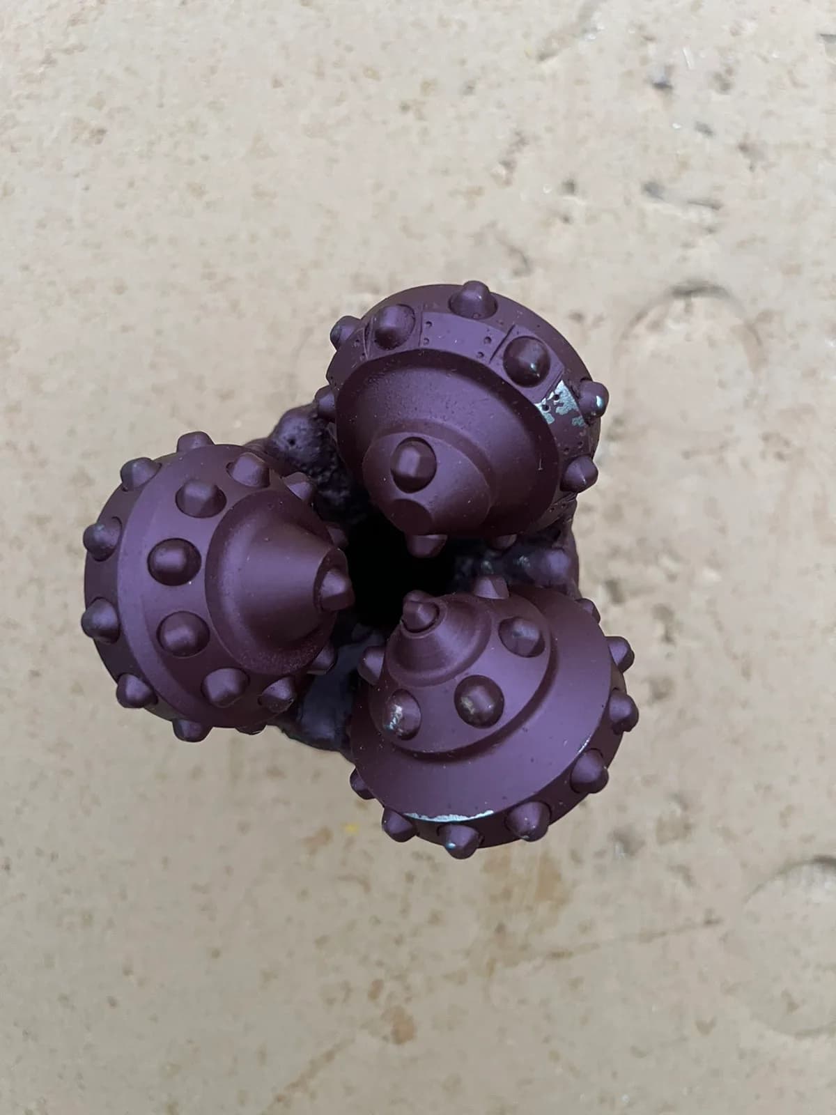 104.8 mm (4 1/8") Tricone Bit with Carbide Inserts (TCI), open bearing, IADC 523, 2 3/8 API Reg — UBM